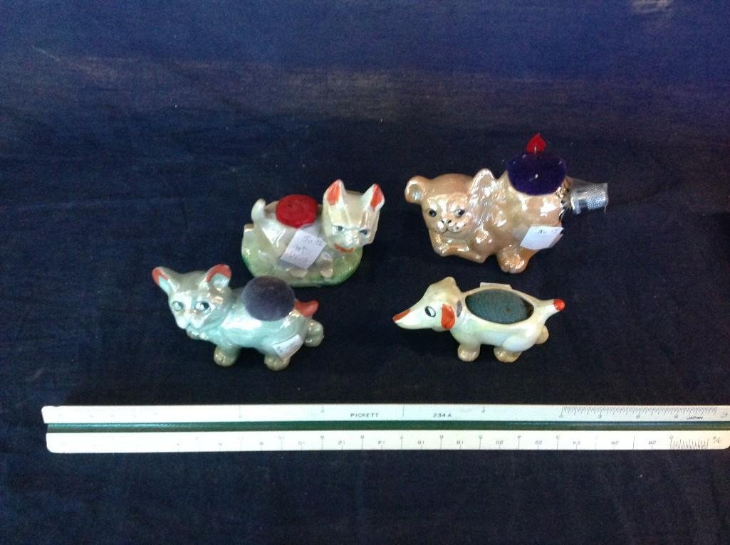 Vintage Ceramic Animal Pin Cushion Holders (4): Very cute assortment of Vintage Ceramic Dog and Cat Pin Cushion Holders, one includes thimble. Assortment includes two cats and two dogs are in great condition.