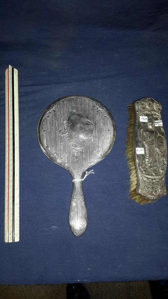Silver Plate Hand Mirror and Clothing Brush: Hand mirror is beveled and 10.5" long, clothing brush is 7.5" long, Condition is fair for the age