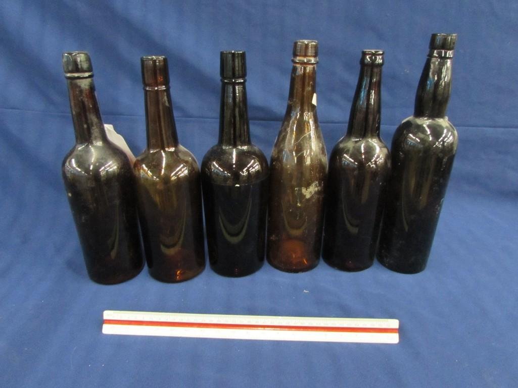 Amber glass bottles (6): All are in good condition, sizes ranges from 11.5"- 12.5" tall