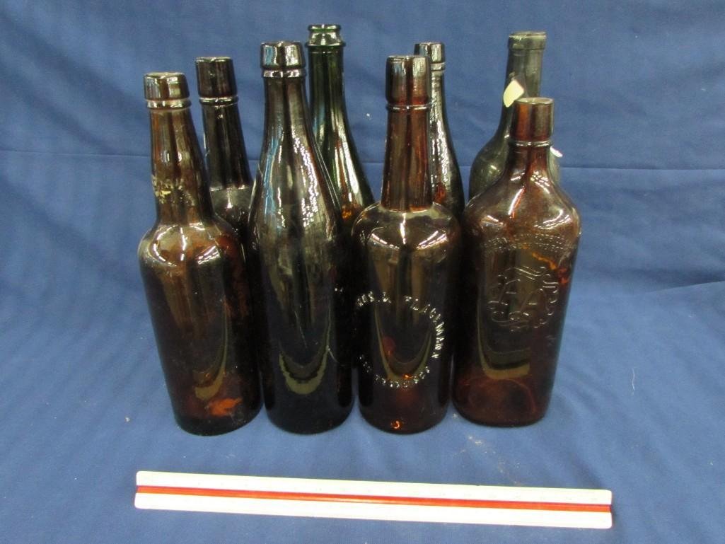 Vintage Amber Glass Bottles (8): Sizes range from 10.5"- 12" tall