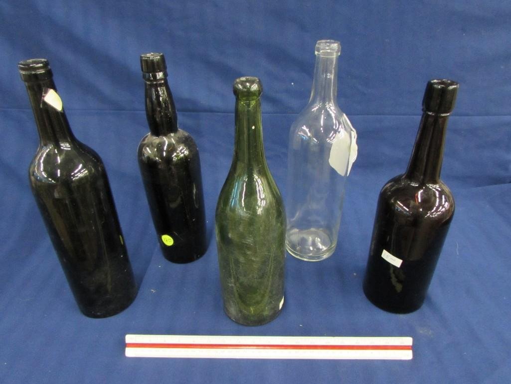Vintage Glass Bottles (5): (3) Amber glass, one clear glass & one green glass, sizes range from 11.5"- 12.5" tall