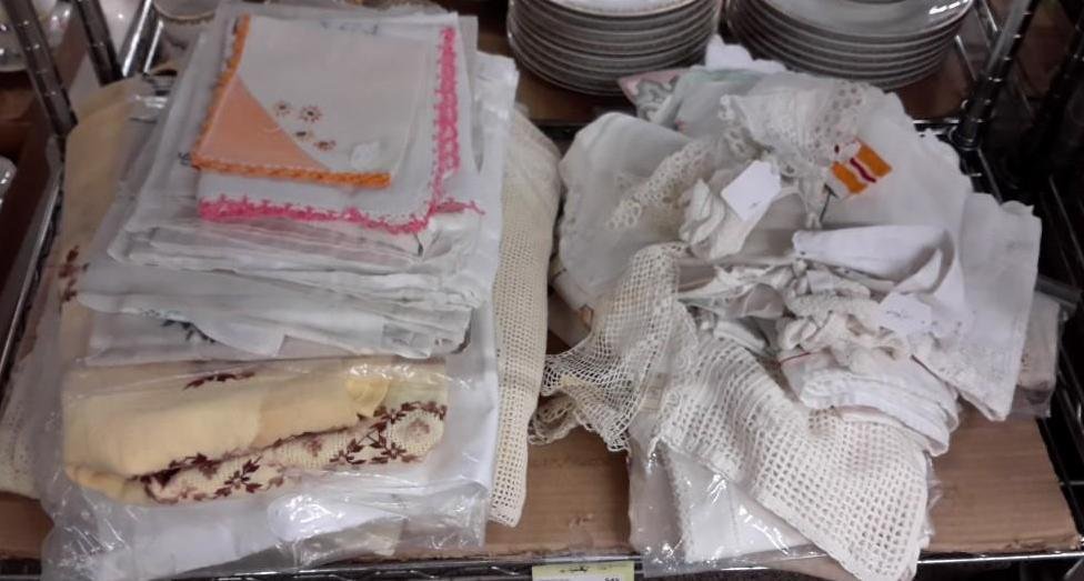 Assorted Linens: Table toppers, crochet and needle point linen, and table cloths