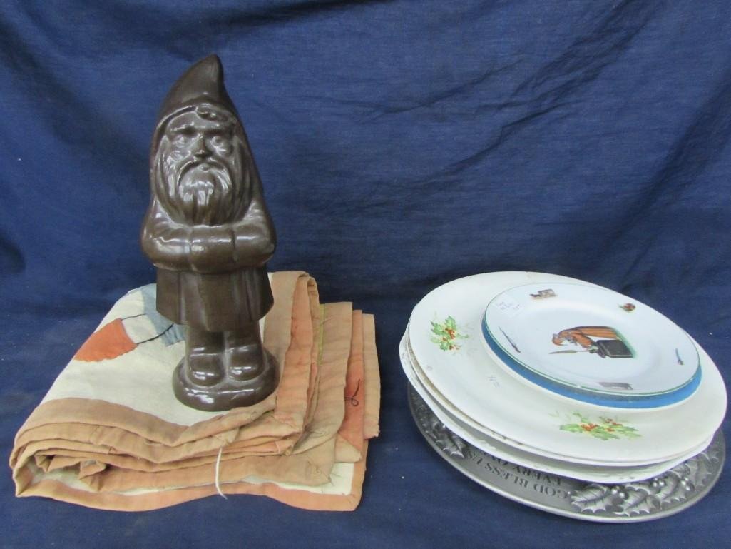 Decorative Plates, Hand stitched place mats, and a: (7) decorative plates some marked Germany, Schwarzberg, ceramic gnome is 10" tall, (4) hand stitched place mats have picture of man riding a donkey, possible made in Egypt