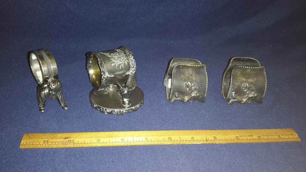 Quadruple plated vintage Napkin Ring: Nice Quadruple plated vintage napkin ring with crouching young boy holding up ring. Napkin ring is inscribed Peg and numbered 90. Good condition.