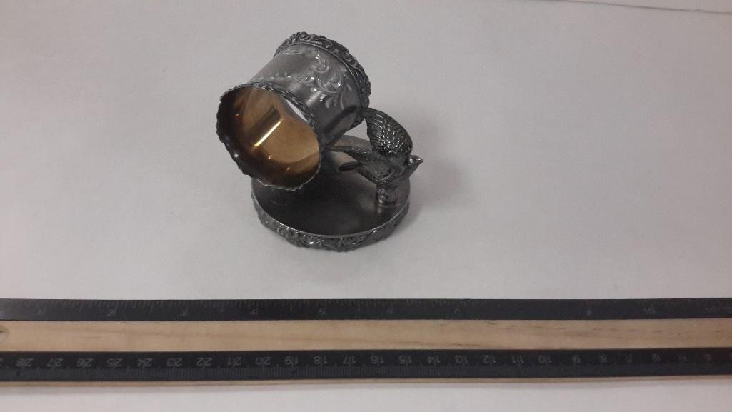 Quadruple plated vintage Napkin Ring: Very nice Quadruple plated vintage napkin ring on stand with bird. Marked Hamilton Mfg. Beautiful ornate edges and etched design. Napkin ring is in good condition has some tarnish.