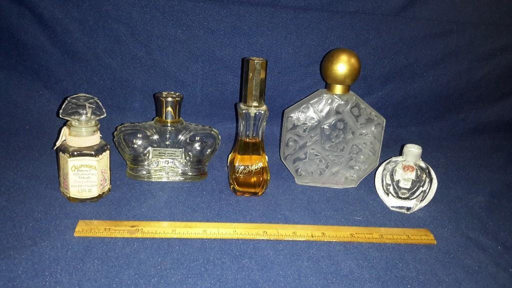 vintage perfume bottles (5): some with perfume, some empty: Georgio (half full), Trailing Arbutus (half full), empty Wind Song, Orrefors Swedan art glass perfume bottle no stopper, plus one other empty clear glass bottle