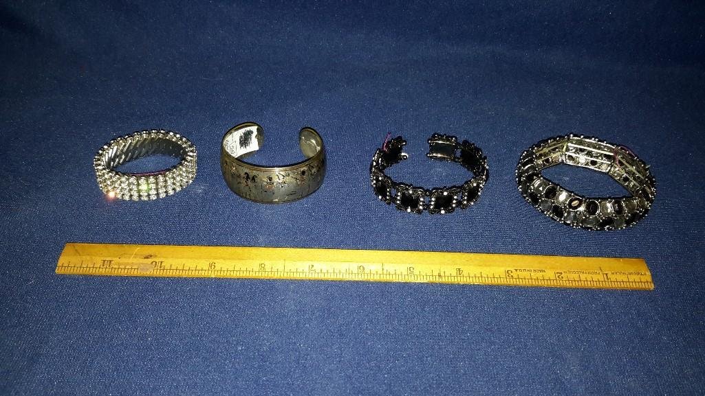 Vintage Rhinestone & Silver Bracelets (4): 1 bracelet has clear rhinestones (2" across), 2 bracelets has black rhinestones (2.75" - 3" across). Silver bracelet is stamped ("Reed & Barton", Damascene) silver. S