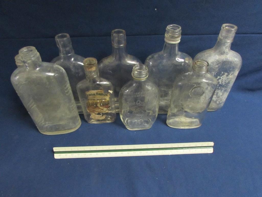 Vintage Bottle Collection (9): Collection of clear glass vintage bottles in various types. In good condition, showing age. One is a old Quaker bottle and more.