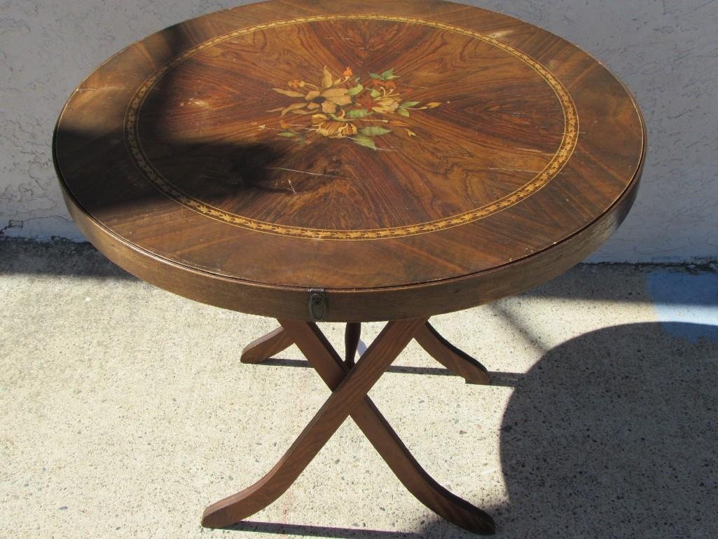 Vintage Round Folding Table: Hand painted floral design wood folding table. 27 inches tall and 29.5 inches wide. Table is in fair condition. 