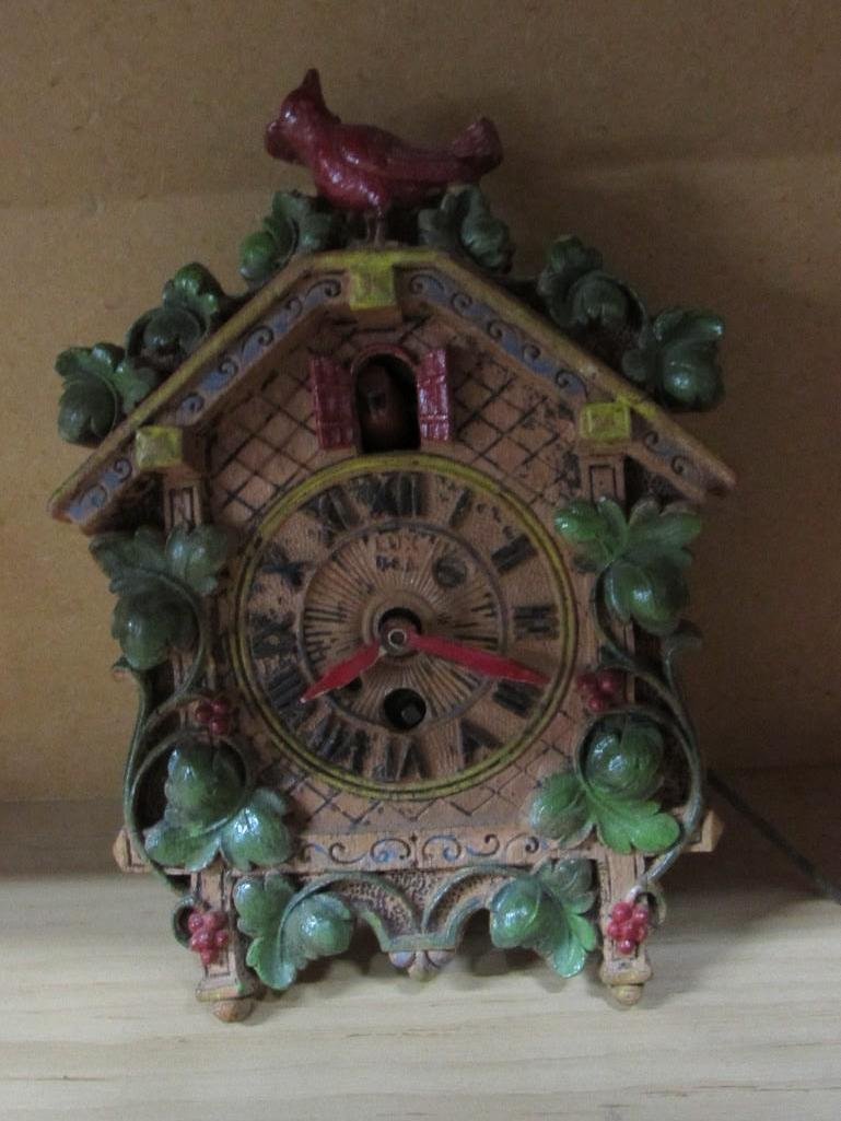 Music Box, Cuckoo Clock, and Bobble Heads: Cuckoo clock is by Lux mfg. co. inc. need repair, boy and girl bobble head that say kiss me, and a wood Lara's theme, made in Switzerland 