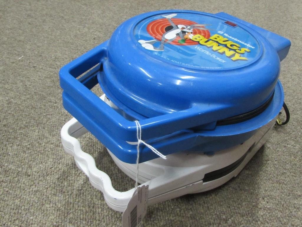 Bugs Bunny and Snoopy Waffle Irons(2): Blue Bugs Bunny waffle iron is 10.5" long. Snoopy waffle iron is 11"long.