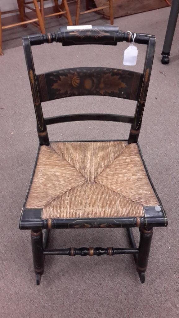 Stamped Hitchcocks Wooden Rocking Chair: Stamped L. Hitchcocksville Conn.Warranted on back of seat. Woven rush seat. Gold paint detailing. Measures 31.5" tall by 24" deep. 