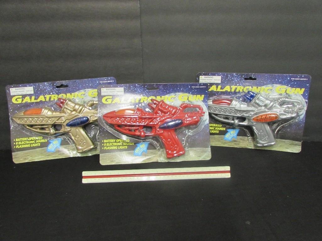 Galatronic Guns (3): All are in original packaging, battery operated, 8 electronic sounds, flashing lights