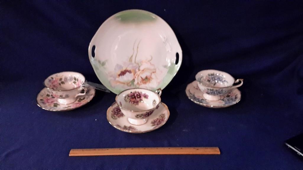 Decorative German Plate and Cups and Saucers (4): Plate stamped Germany and measures 9 1/2" diameter, hand-painted. Cups and saucers marked Ornamental Collectibles and measure 2 1/2" tall.