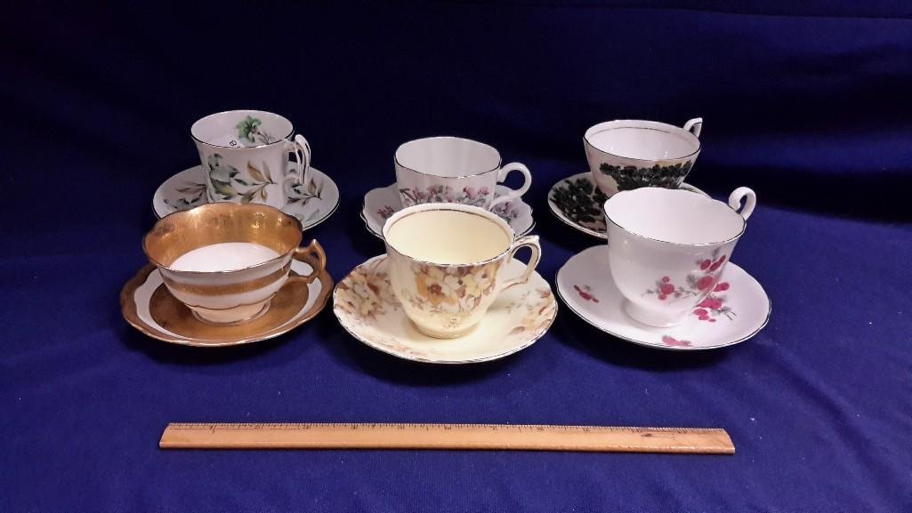 Cup and Saucer Collection (6): 6 sets. Marked; Royal Chelsea; Taylor and Kent; Radfords; Cresent. Ranging in size 2 1/2" tall to 3 1/2" tall. 