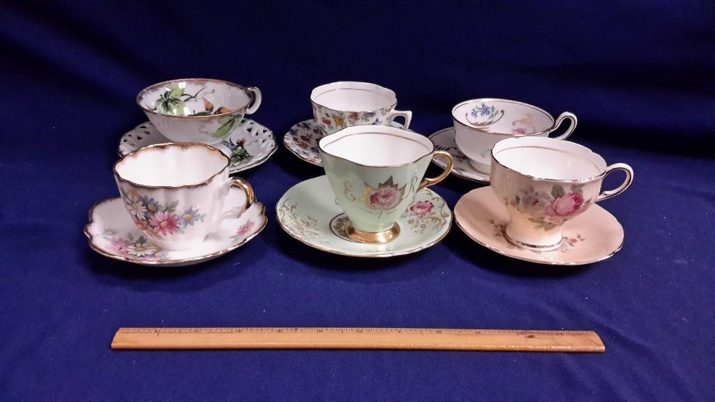 Collection of Cups and Saucers (6): 6 sets. Rosina; Taylor and Kent; Windsor Bone China; and more...Ranging in size from 2 1/2" tall to 3 1/2" tall. 