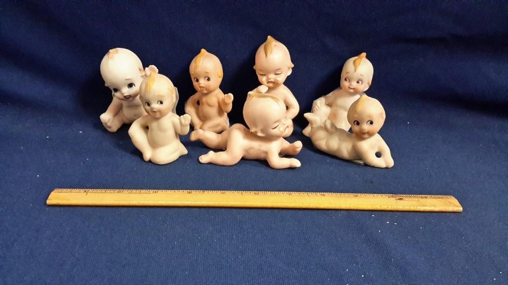 Kewpie Piano Baby Figurines (7): Sizes range from 2 1/2" to 4" tall. Some sad, some happy. 