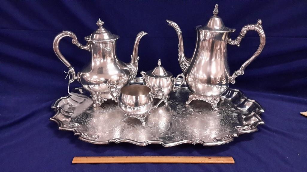 Silver Plate Tea Set and Tray (5): Silver Plate tea pot, coffee pot, creamer and sugar and tray. Tea pot measures 11" tall, coffee pot 9 1/2" tall , cream 5 1/2, sugar 3/12" and tray measures 21 3/4" long by 1