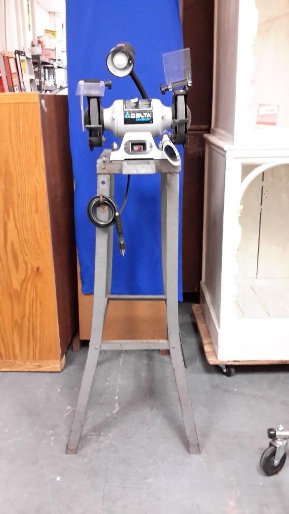 Delta Shop Master 6" Bench Grinder: Model # GR150. RPM 3600, Serial # 215425W6032. Class A. On metal stand. Measures 49" tall with grinder and 23" wide. Great condition. Manual included. Includes attached lamp. 