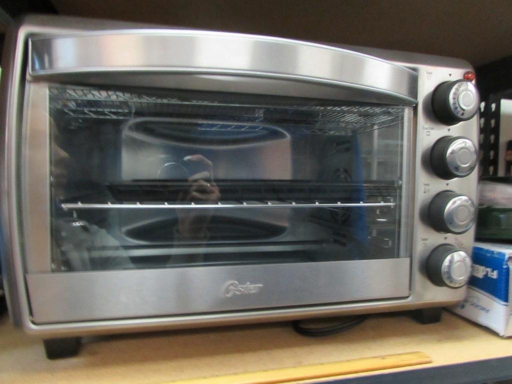 Oster Convection Counter top Toaster Oven TSSTTVCG01: Never used. Includes instruction manuals. 