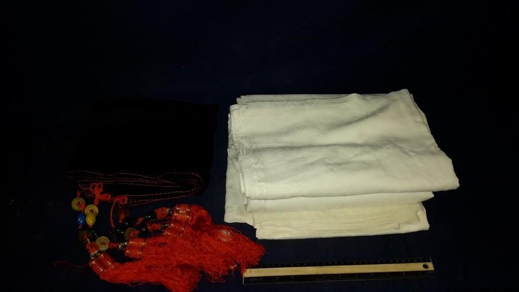 Table Cloths (3): 2 large white table cloths and 1 small black and red with decorative bells and stones on corners.