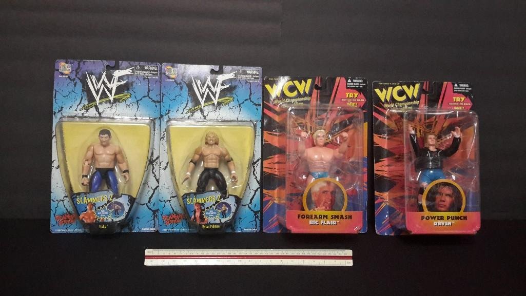 WWF & WCW Action Figures (4): All are in original packaging, Brian Pillman, Taka, Ric Flair, & Raven