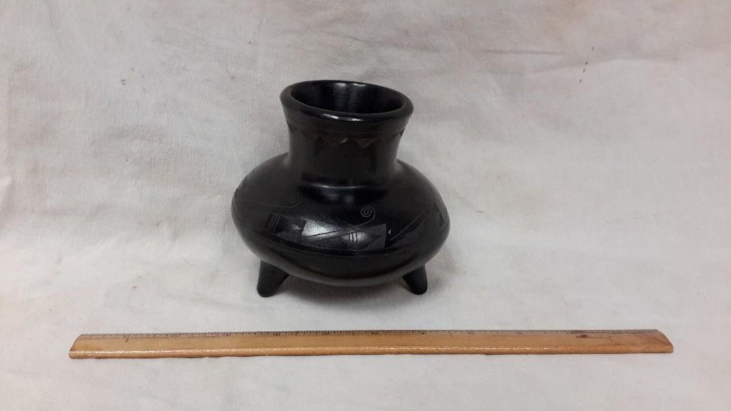 P. Mateos Signed Black Pottery: Signed on bottom, "P. Mateos, Mexico" Measures 4.5" tall, carved design on outside, stands on three legs.