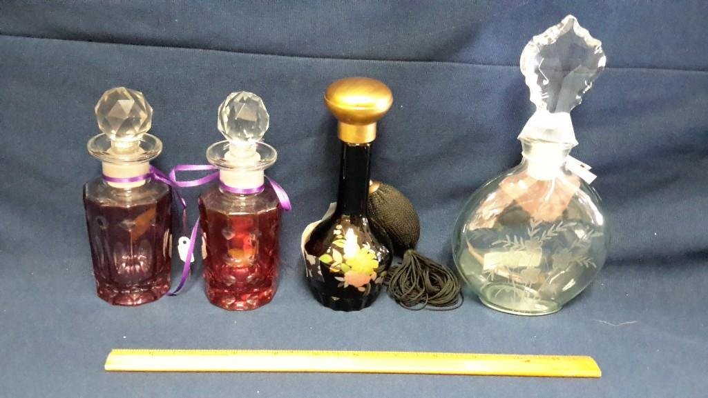 Perfume Bottle Collection (4): Black glass with atomizer, Cellini Collection perfume bottle with etched glass, 2 Victorian colored glass bottles with stoppers. Range in size from 5.75" to 8". 