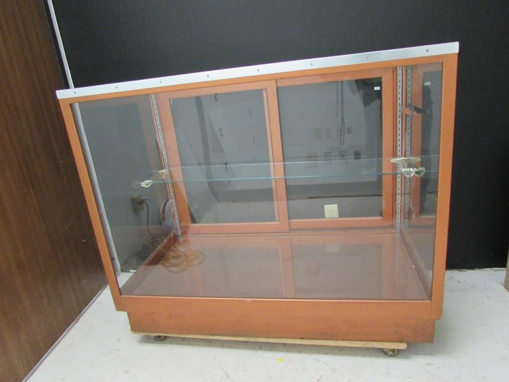 Back Loading Store Display Case: Nice wood framed display, glass top and glass all around. includes one glass shelf, 48"w x 40" T x 27" d