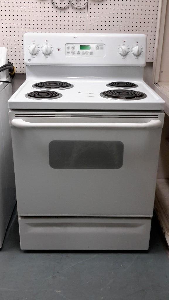 GE Electric Range: Four burners, two small, two large, 47" tall X 30" wide