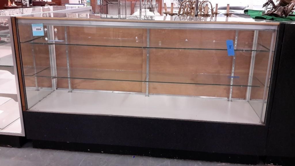 Back Loading Store Display Case: Glass Top, Two glass shelves, Back has cubby holes for storage. 72" wide x 38" tall x 20" deep