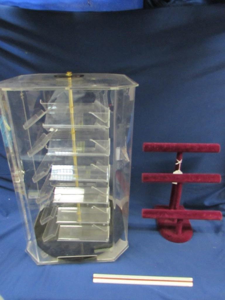 Rotating Display Case and Jewelry Display: Rotating display case measures 24 1/2" tall, 16" wide and deep. Made of plexi glass. Jewelry display measuring 14 1/2" tall, 12" wide - 3 tier, burgundy color. 