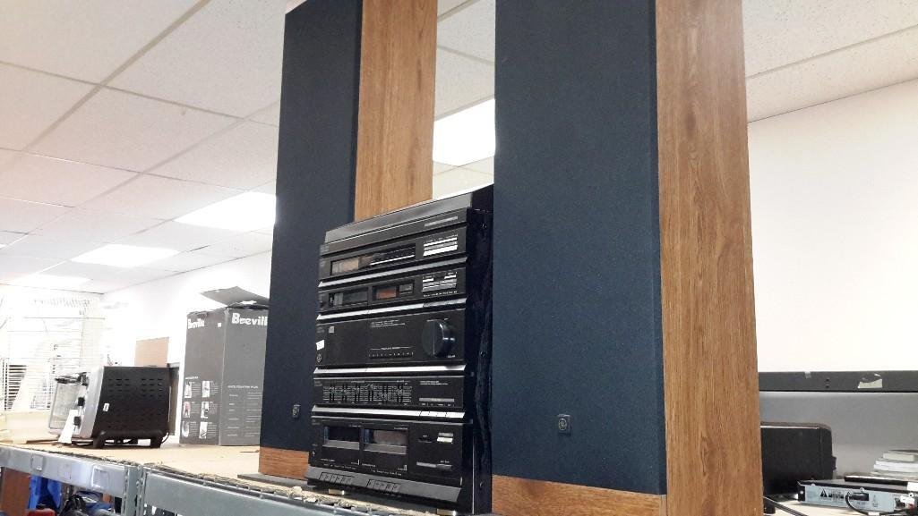 GE Stereo System with Two Speakers: Belt drive turn table, compact disc, dual cassette, Model #11-9100A. Plugs for speakers. Speaker Model #11-9100. Stereo measures 18 1/2" tall 17" wide and 14" deep. Speakers measure 39