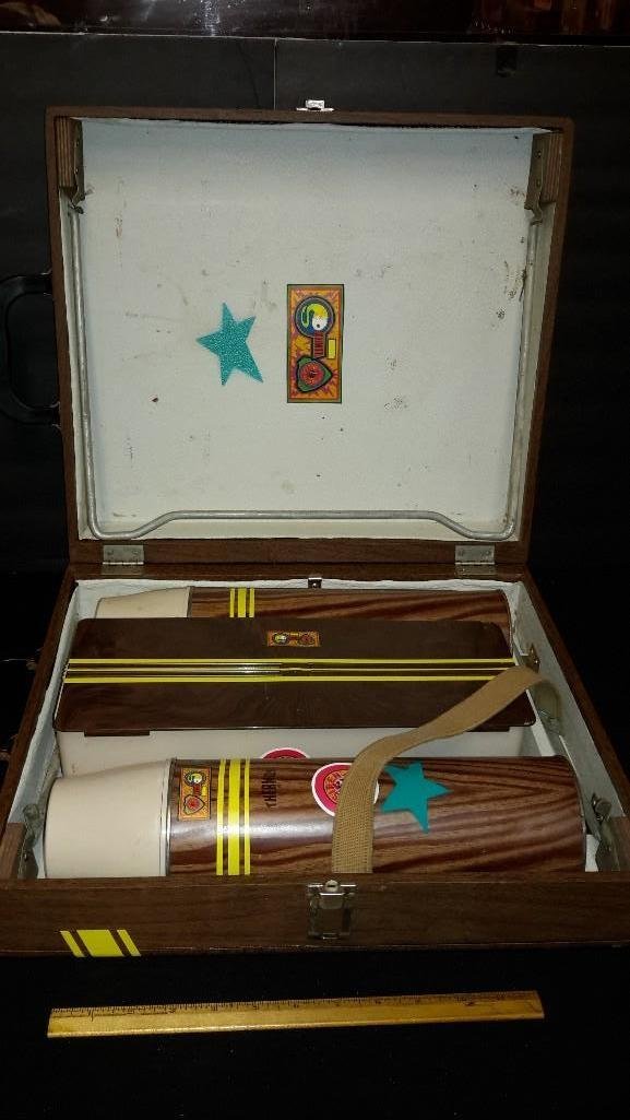 Vintage Picnic Basket: Carrying case unfolds into a table, includes two large steel thermos bottle, & food container, good condition