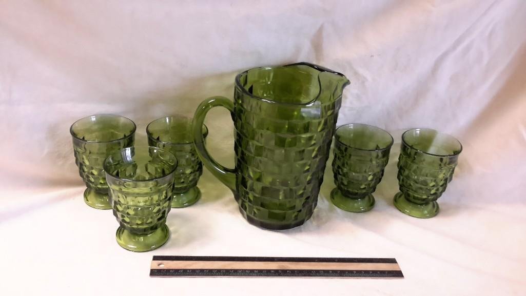 Green Glass Pitcher and Cup Set (6): Pitcher stands 9" tall, cups measure 4 1/2" tall with block pattern.