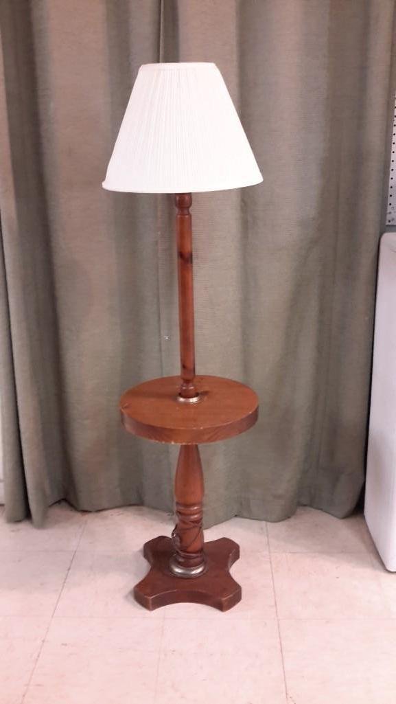 Vintage Table Lamp: Pine base table with attached lamp. Stands 56 inches tall and table is 15 inches across. 