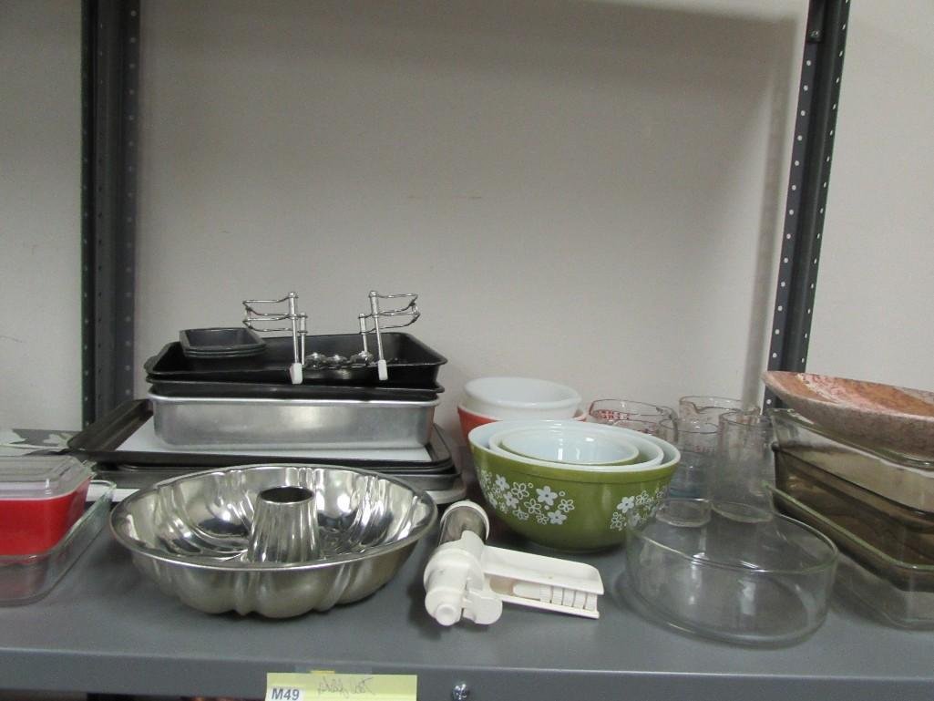 Kitchenware Assortment: Baking pans, measuring cups, mixing bowls, and more