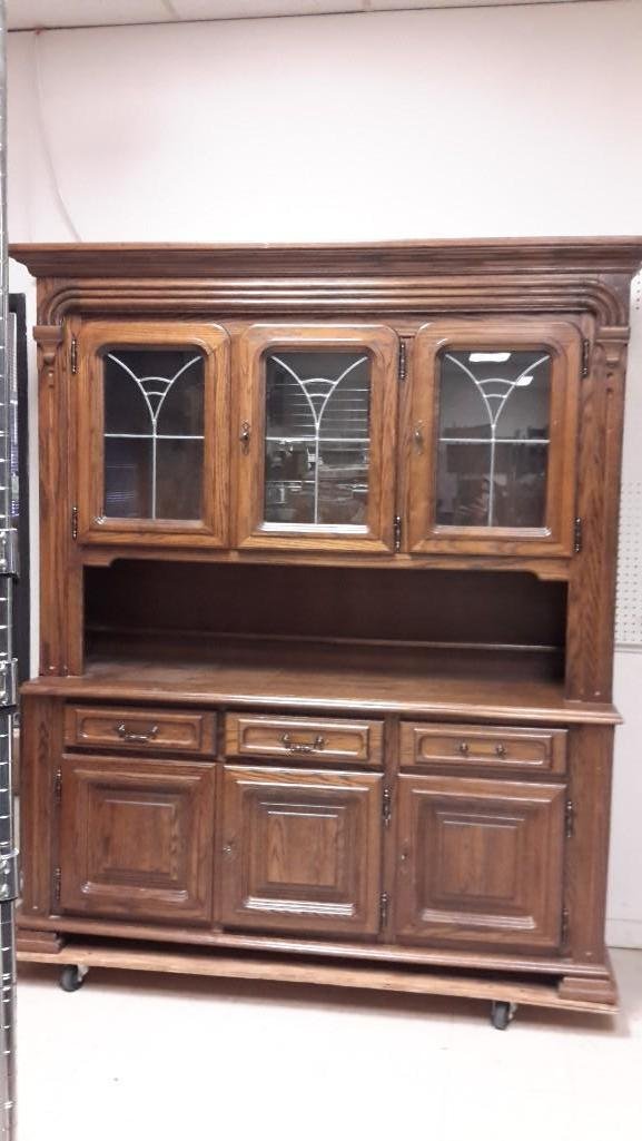 Large Wood Hutch: 3 cabinet doors on top with left 2 doors opening together and a glass shelf for both sides, 3 doors on bottom with 2 left doors opening together, 3 drawers (one missing hardware). Comes with 4 keys. P