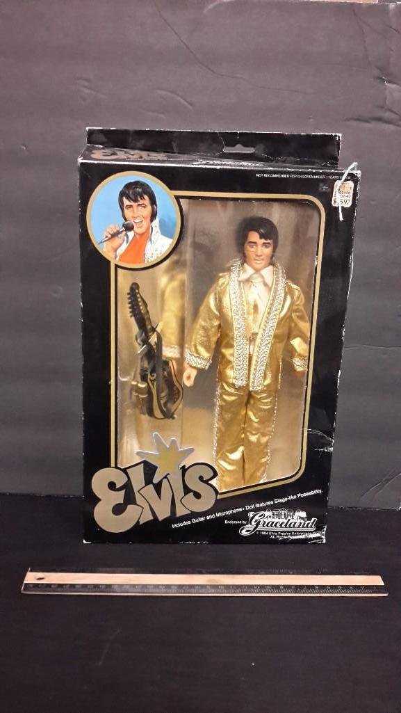 1984 Elvis Presley Doll: In original packaging, includes guitar and mircrophone