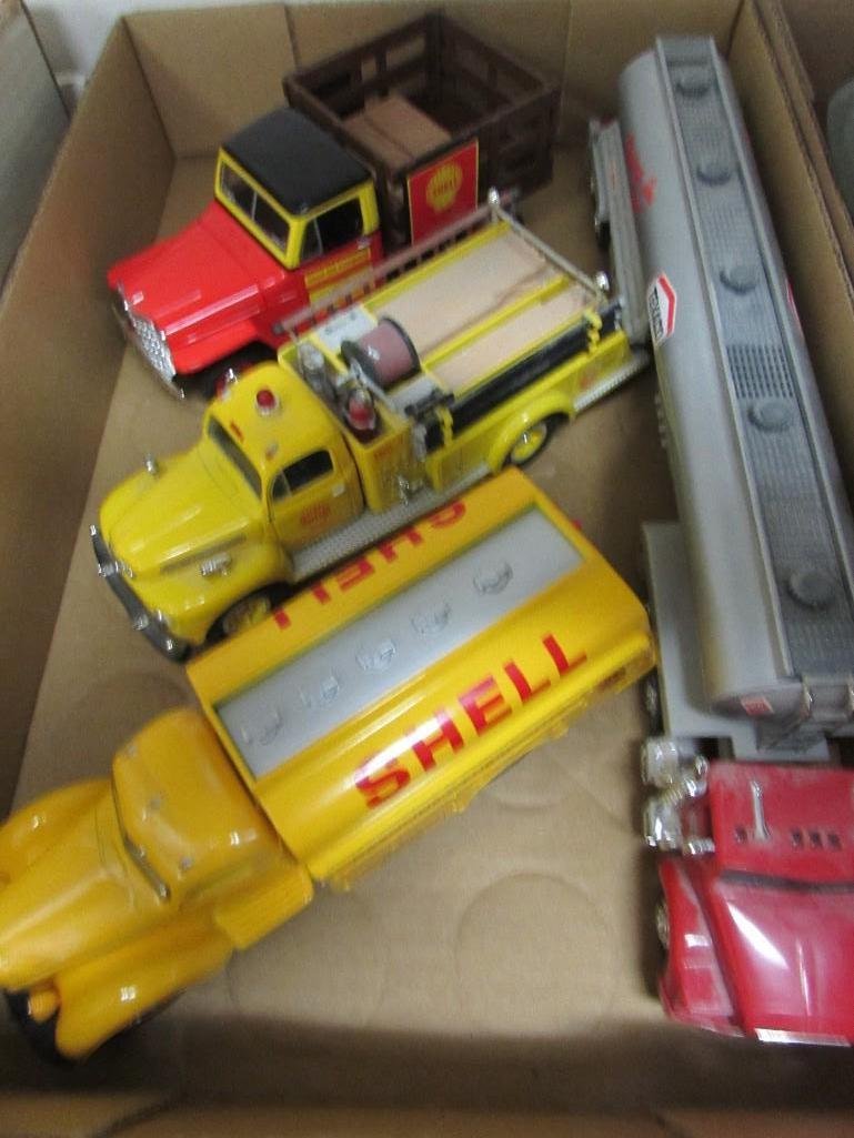Miniature Gasoline Company Trucks (4): Shell Replica 1949 International truck with extra pieces taped to bottom, Shell replica 1951 Ford truck, Shell replica 1953 Jeep piggy bank, 1995 Edition Texaco plastic tanker truck. 