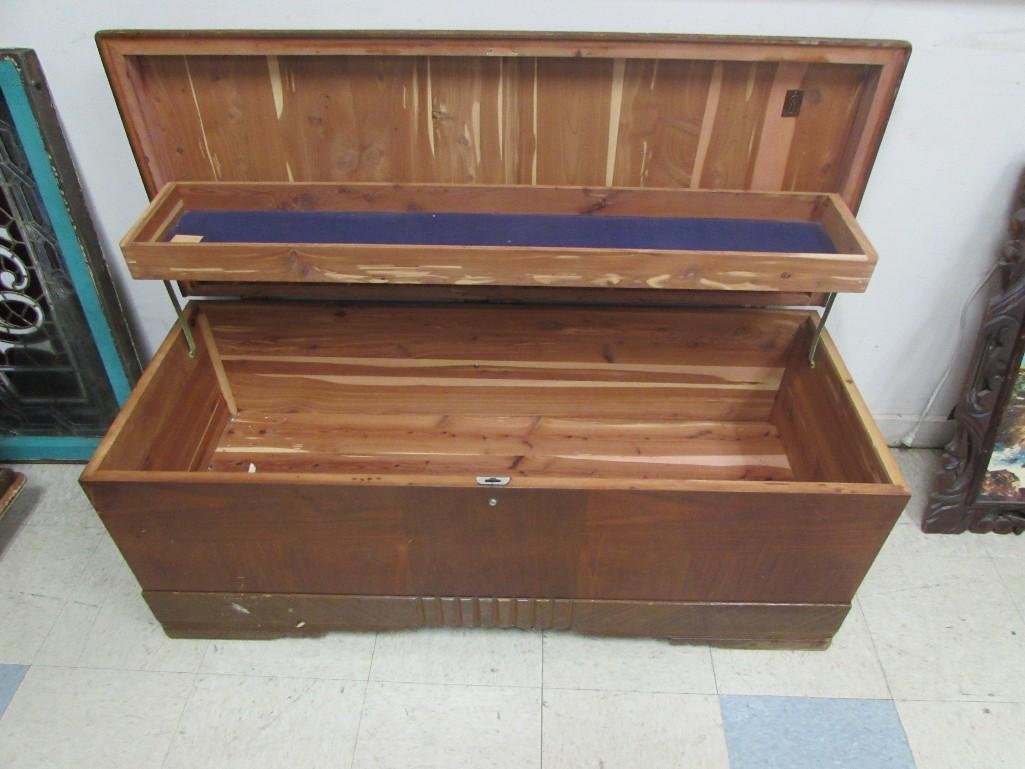 Cavalier Vintage Waterfall Hope Chest: Opens to one shelf and cedar inside. Top has burn damage. Measures 48 x 20 x 18 1/2" . The inside is in great condition. 