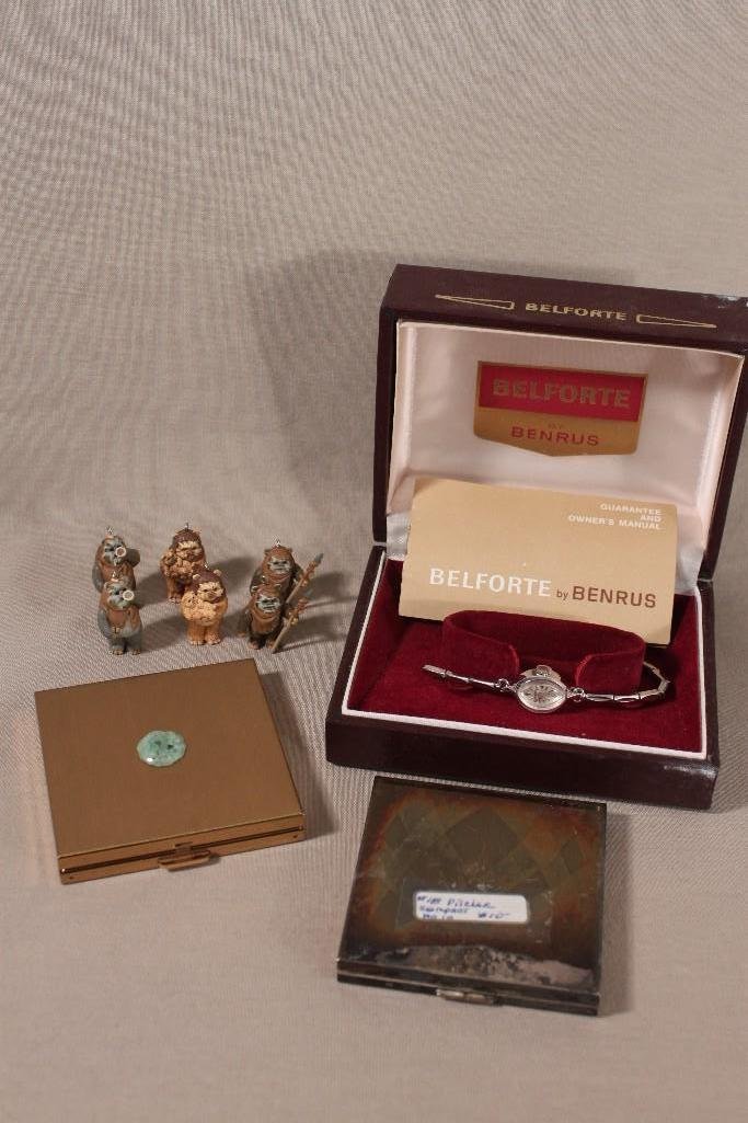 Ladies Benrus Wrist Watch & Compacts: Silver tone Benrus watch with case band need to be repaired, (2) vintage compacts Pilcher & Volupte, plus (6) EWOK plastic charms 