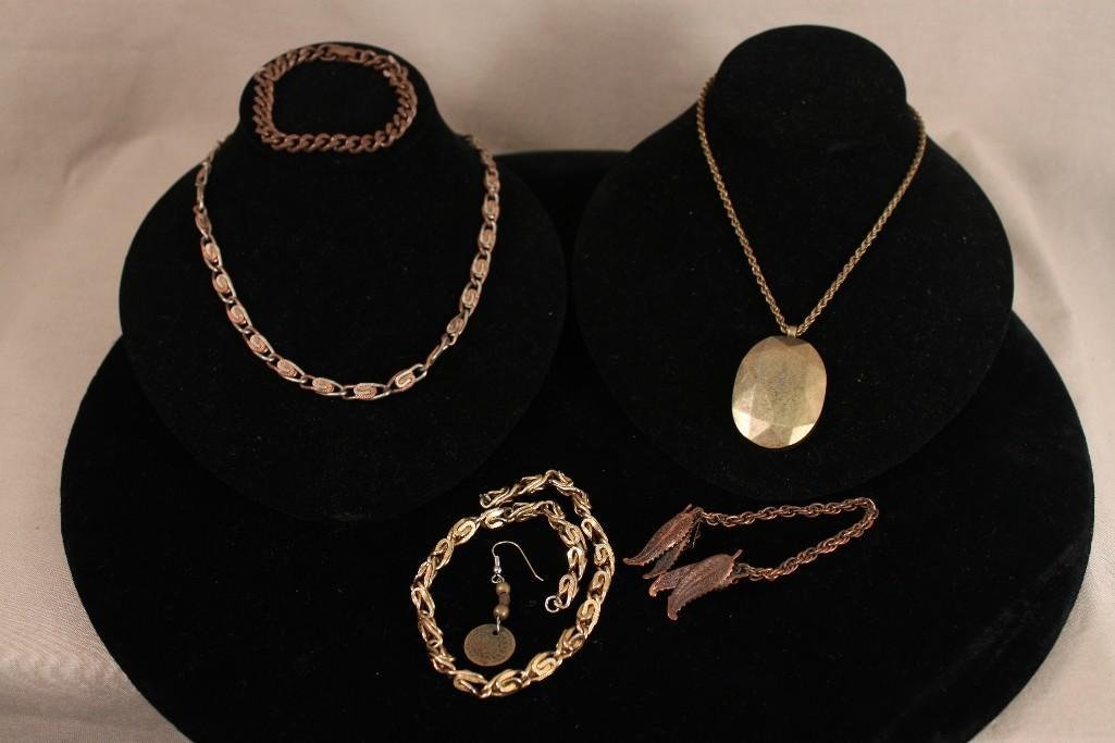 Copper and gold tone Jewelry: Copper chains, necklace, and bracelets, copper sweater guard, and gold tone pendant and chain