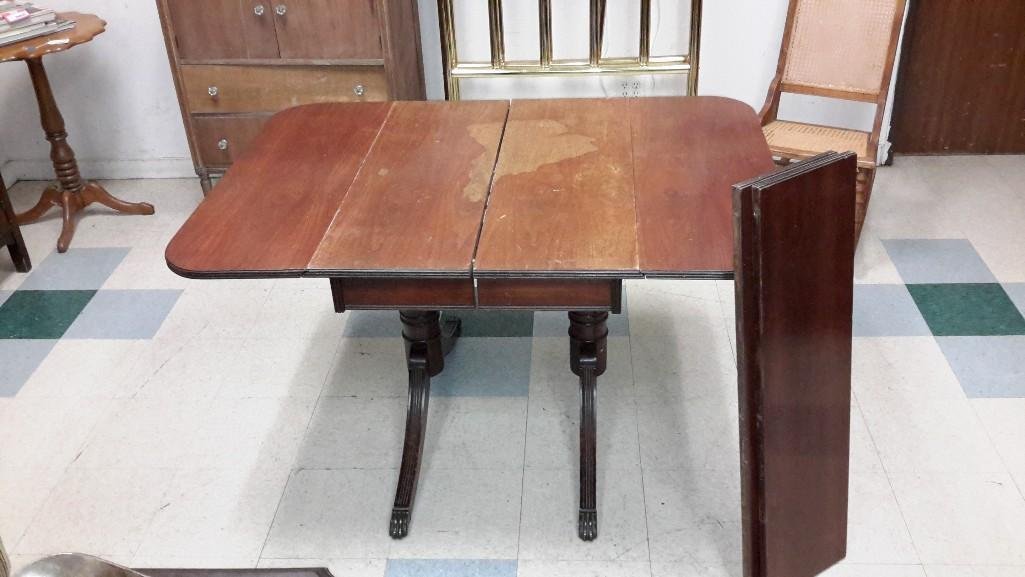 Duncan Phyfe Style Drop Leaf Table: Table top shows a lot of wear, 52" long with the drop leaves in the up position.