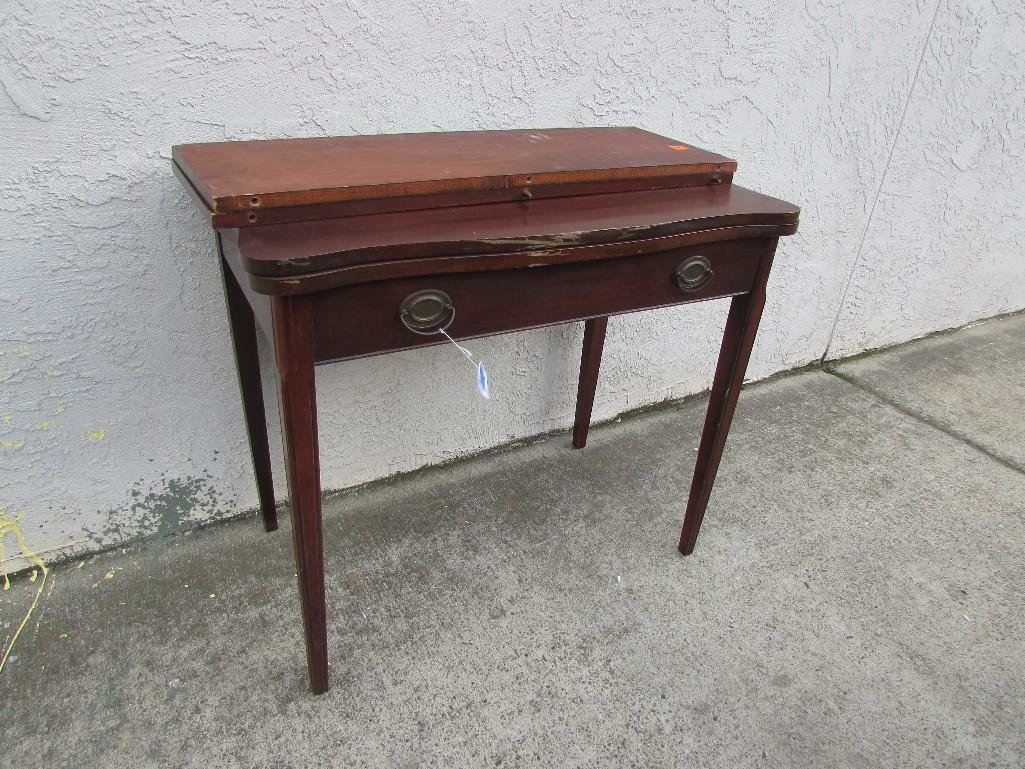 Duncan Phyfe Style Table: 20" table that extends to 64", includes two leaves. Prior to extension it is 36" x 20". when fully extended it has six legs.