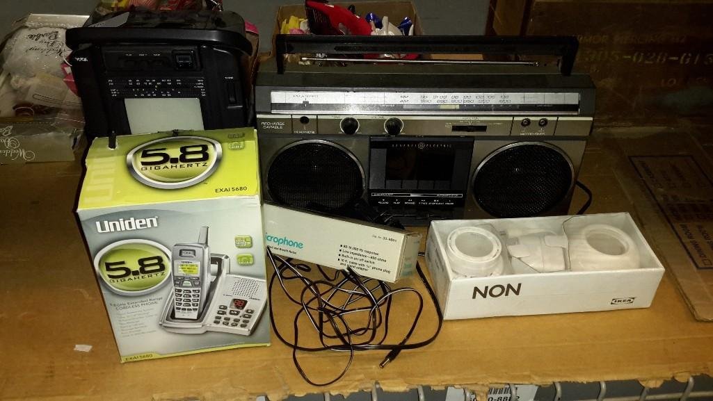 Electronic Assortment: GE Single cassette boom box, Yorx black and white TV radio cassette, Unidon cordless telephone , Ikea lights, Highball Dinamic Microphone. 