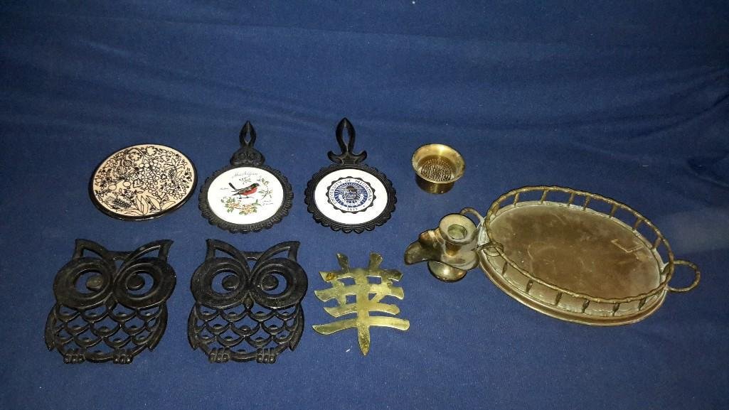 Metal Trivets and Brass Decor: (2) Owl shaped metal trivets, brass tray, candle holder, & flower frog, and others 
