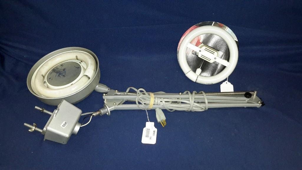 Table Mount magnifying Glass: Electric, industrial size, has adjustable arms, comes with extra light bulb