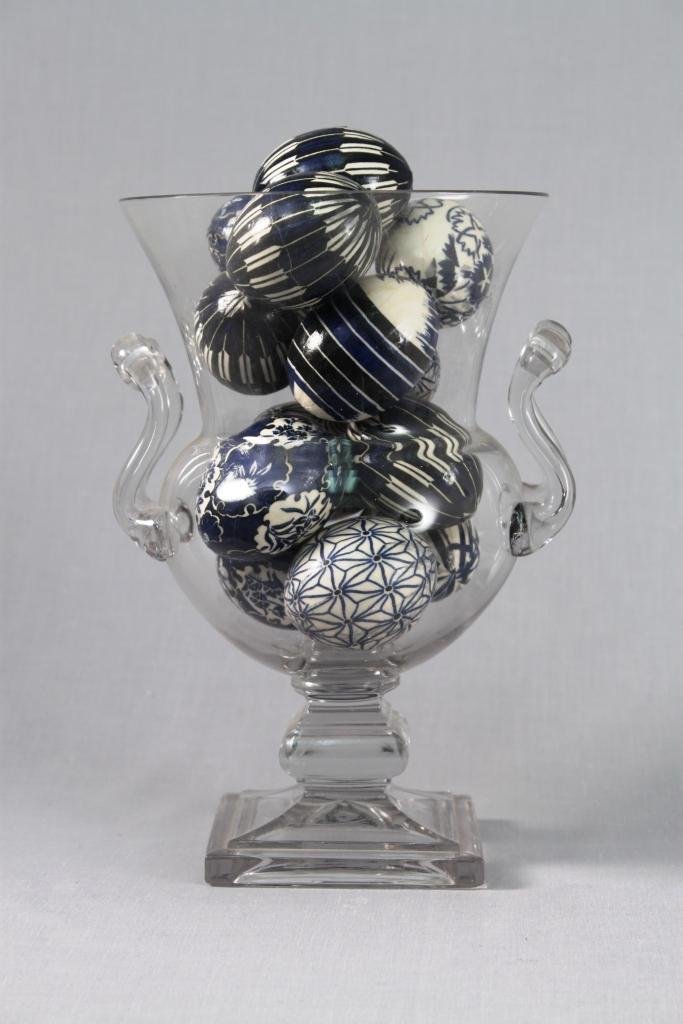 Hand Crafted Eggs and Crystal Vase (14): thirteen blue and white egg shells and one clear glass vase that stands 9.5" tall.