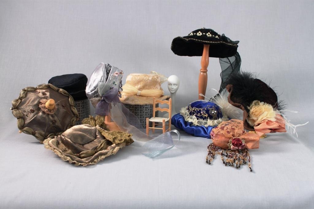 Assortment of Miniature Hats (17): various items which includes hats, hat stand, umbrellas, and more. Largest hat is 6" and the smallest hat is 3"